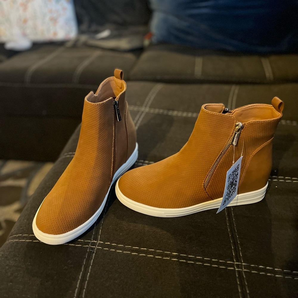 Camel colored side zip high top boat shoe